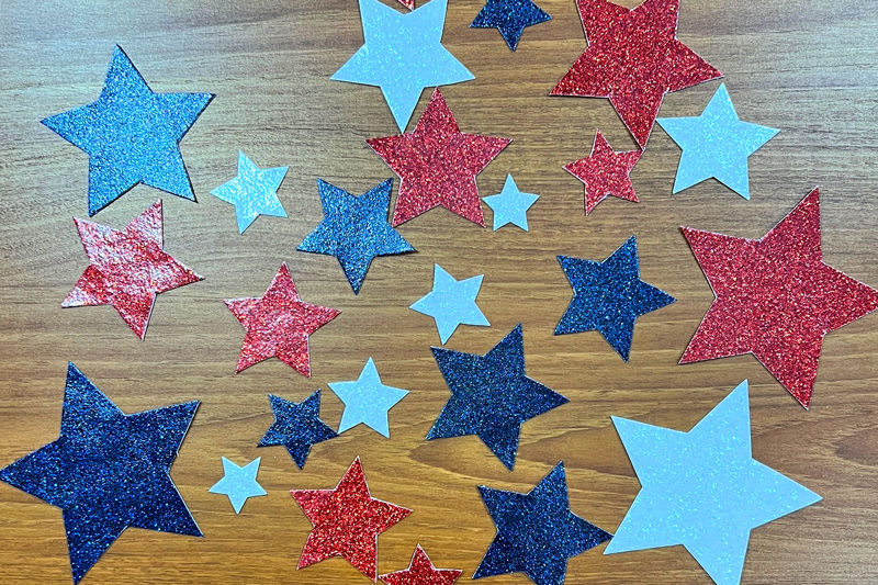 Stars & Stripes Quilted Placemats cut luxe sparkle vinyl stars and place